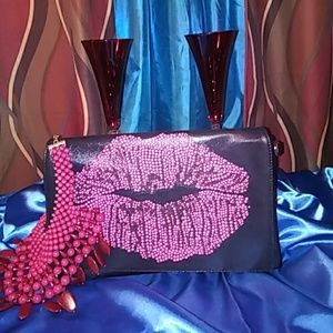 Ladies black and pink clutch bag